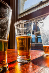 Glasses of light beer on the table