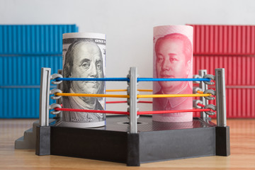 Global world economy crisis situation, US vs China trade war and currency war concept. US dollar and Chinese yuan banknotes fights on hexagonal ring arena with containers background.