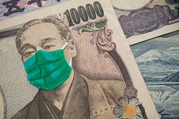 Men wear face mask on Japanese yen bill banknote background. Global novel coronavirus (Covid-19) outbreak effect to Japan and world economy, financial crisis, travel hotel business, tokyo olympic 2020