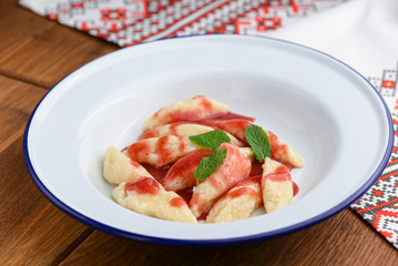 Dumplings, filled with cherries, berries. Pierogi, varenyky, vareniki, pyrohy - dumplings with filling.