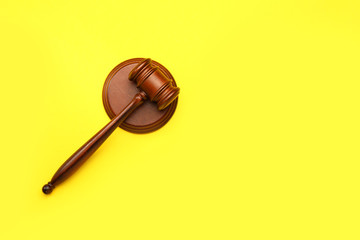 Judge's gavel on color background