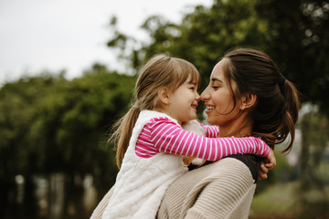 Babysitter with a girl at the park