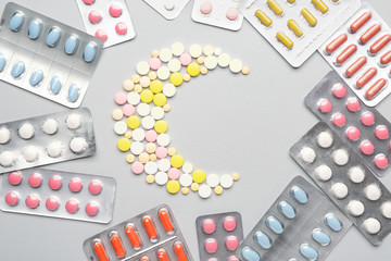 Composition with sleeping pills on light background