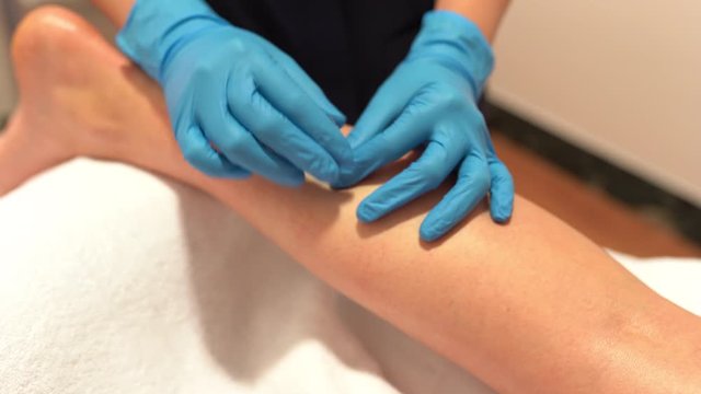 Hands of physiotherapist doing a dry needling