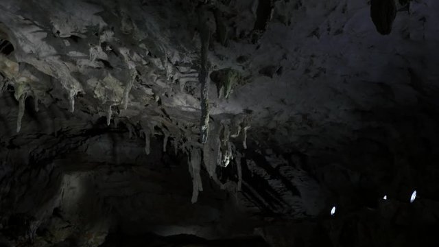 These stalactites look like icicles on the ceiling of a limestone cave.