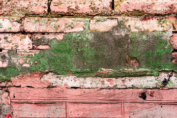 Texture of a brick wall with cracks and scratches which can be used as a background