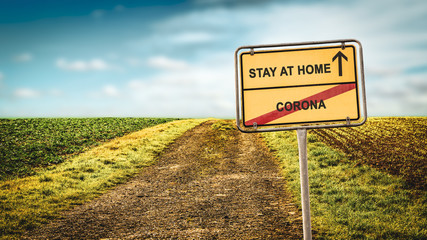 Obraz premium Street Sign STAY AT HOME