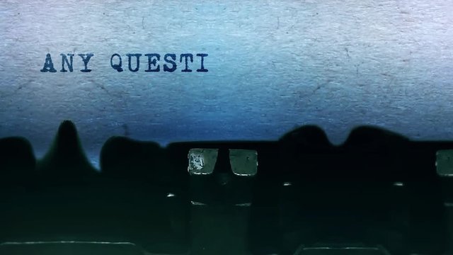 Any Questions Word closeup Being Typing and Centered on a Sheet of paper on old vintage Typewriter mechanical 4k Footage Background Animation.