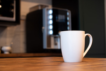 White mug on kitchen background