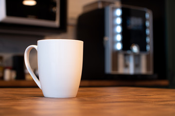 White mug on kitchen background