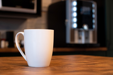 White mug on kitchen background