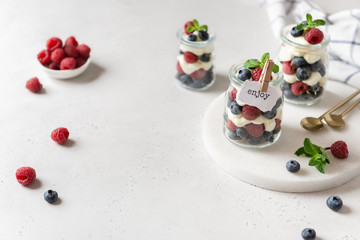 Obraz na płótnie Canvas Raspberry dessert, parfait, trifle, mouse in a glass. Confectionery menu. Summer dessert. Copy space