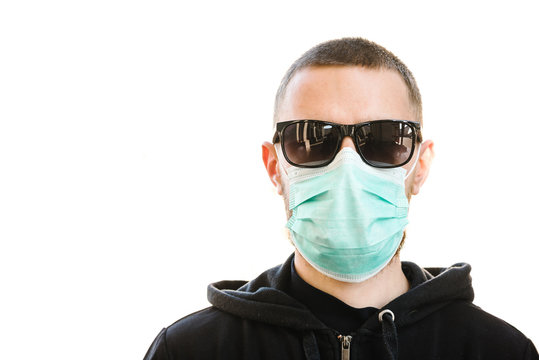 Man wearing hygienic mask to prevent the virus PM2.5 and Coronavirus. People in masks. The outbreak of Novel Corona virus (2019-nCoV) in Wuhan China. Air pollution, Environmental awareness concept.