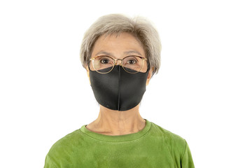 Old woman wearing a protective face mask in the white background.