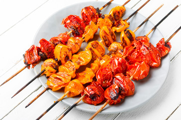 Grilled tomatoes on skewers.
