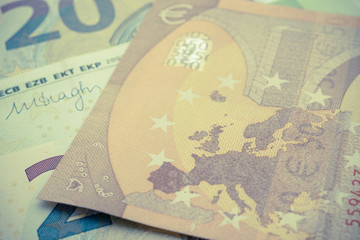 Macro shot focus on England in Europe map on money cash euro banknote background. The currency of the euro country area and institutions. European Union ( EU) financial economic or UK brexit concept.