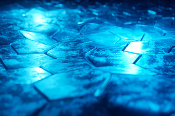 Black and blue glowing hexagons background pattern on textured metallic surface 3D rendering