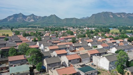 Naklejka na ściany i meble Aerial view of Chinese rural house roofs, beautiful rural scenery