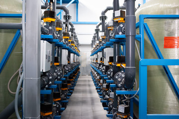 Purified drinking water factory or plant, large iron tanks and water purification filters and automation filtration system. - obrazy, fototapety, plakaty