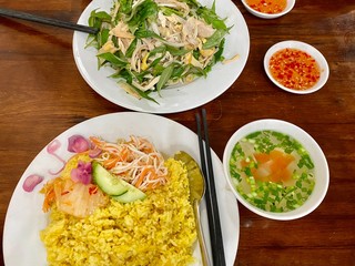 Vietnam traditional Phu Yen com ga chicken rice and salad, soup bowl and dipping sauce