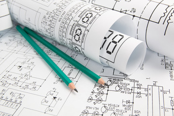 Electrical engineering drawings and pencils. Electronics Engineer project.