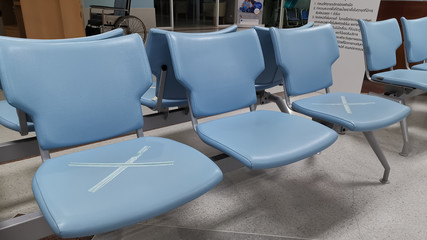 Bangkok, Thailand - March 22, 2020: Social distance concept. At hospital keep spaced between each chairs, epidemic prevention from COVID-19 coronavirus.