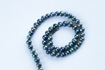 pearl female beads on an isolated background close-up
