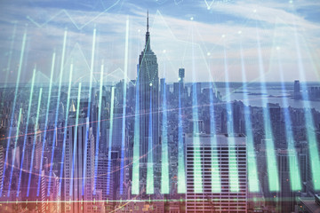 Forex graph on city view with skyscrapers background double exposure. Financial analysis concept.