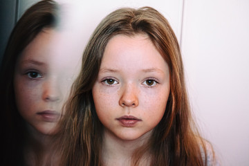 Portrait of a girl and her reflection