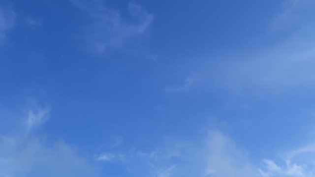 Beautiful white puffy & fluffy cirrus & cumulus clouds on tropical summer or spring bright blue sky background in sunny day TimpLapse for transitional & meditative motion vdo or nature related project