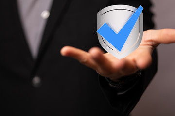 shield protection concept holding in hand digital