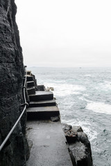 Fototapeta premium The rocky path toward the Fingal's cave in Staffa Island, a little isle in Scotland 