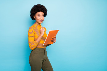 Photo of beautiful writer dark skin wavy lady hold copybook creating thriller have inspiration deep...