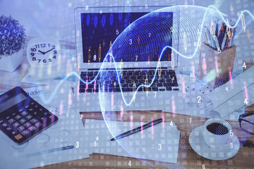 Double exposure of forex chart and work space with computer. Concept of international online trading.