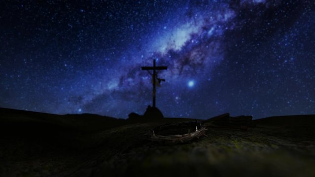 Crucifixion of Jesus Christ with thorn crown, nails, hammer and a rope against milky way starry sky