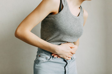 Poisoning and abdominal pain. The zone of injury, the image on a blank background. A spasm in the...