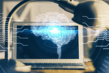 Double exposure of desktop computer and human brain drawing hologram. Ai concept.