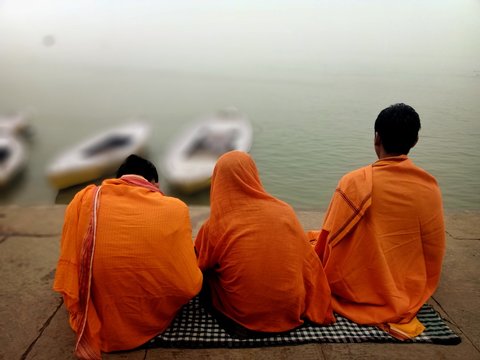 The children of Brahmin cast in India are performing their rituals at the ghats of Varanasi in India at the bank of river Ganges with selective focus.