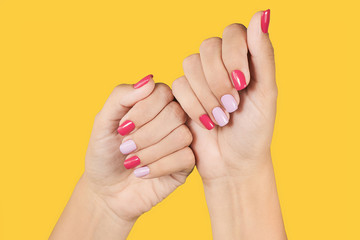 Closeup photo of two female hands and fingers manicured. Fingernails with fresh professional spring...