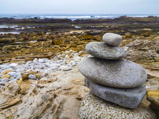 Balance, stack of stones on beach
