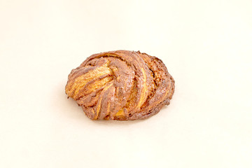 Delicious sweet bun. The assortment of bakery and bakery. Closeup on a light background