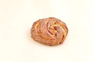 Delicious sweet bun. The assortment of bakery and bakery. Closeup on a light background