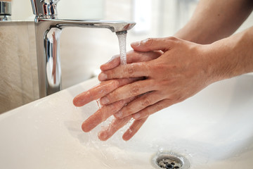 Washing hands rubbing with soap man for corona virus prevention, hygiene to stop spreading coronavirus.