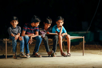 young indian rural child group studying