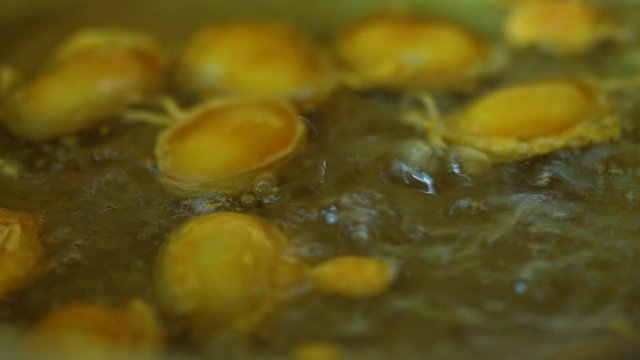 How to made thai dessert, close up fo Bean paste or Med Kanoon boiling in syrup in bronze pan.The most famous of Thai dessert. 
