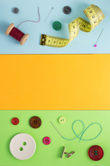 sewing tools and accessories at paper background