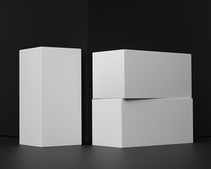 3D rendering of a mock up of rectangular boxes on a background of black paper, for presentation of graphic design