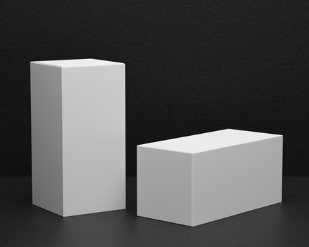 3D rendering of a mock up of rectangular boxes on a background of black paper, for presentation of graphic design