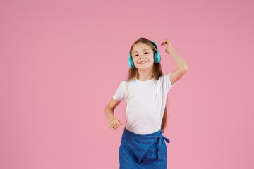 Dancing and singing. Teenager listen music. Recommended music based initial interest. Free music apps for mobile device. Energetic playlist. Girl cute schoolgirl white clothes headphones listen music.
