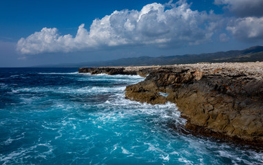 Waves crash on the rocky shore of the Mediterranean Sea on the Akamas Peninsula in the northwest of the island of Cyprus.